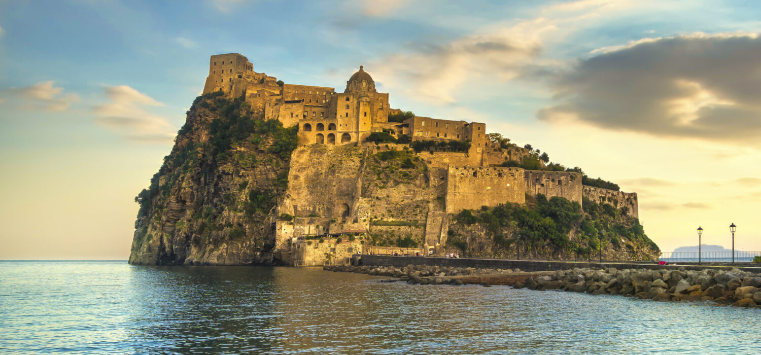 Ischia island and Aragonese medieval castle or Ischia Ponte. Travel destination near Naples in Campania, Italy. Europe.