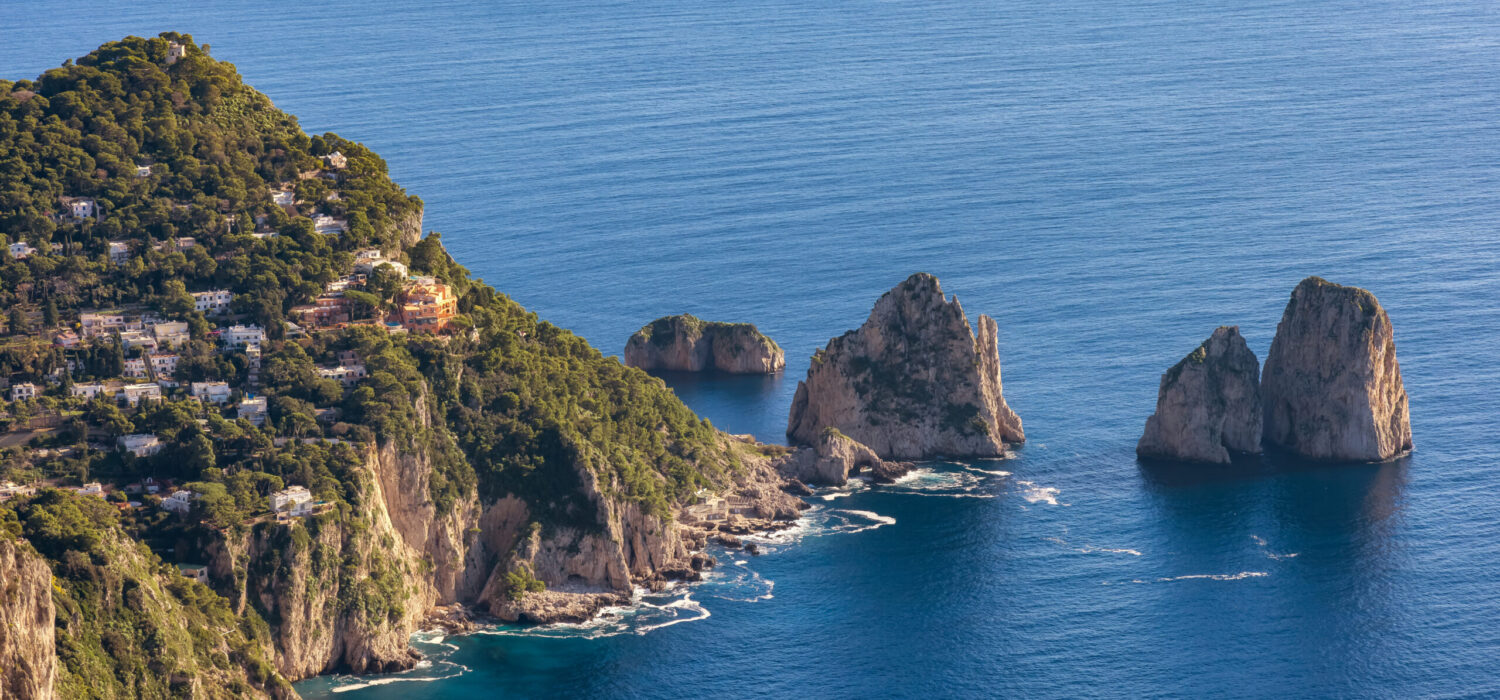 Touristic Town on Capri Island in Bay of Naples, Italy. Sunny Blue Sky.