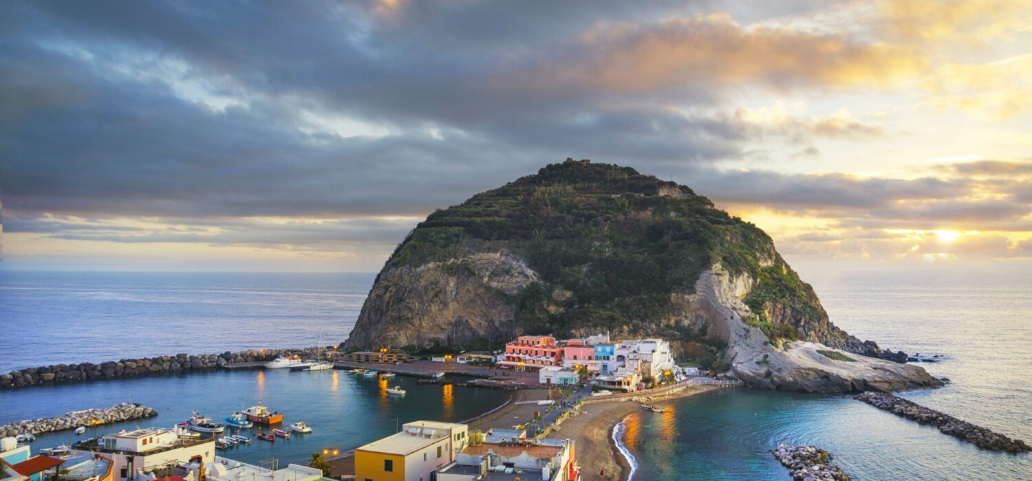 Sant Angelo beach, rocks and islet in Ischia island. Travel destination near Naples in Campania, Italy. Europe.